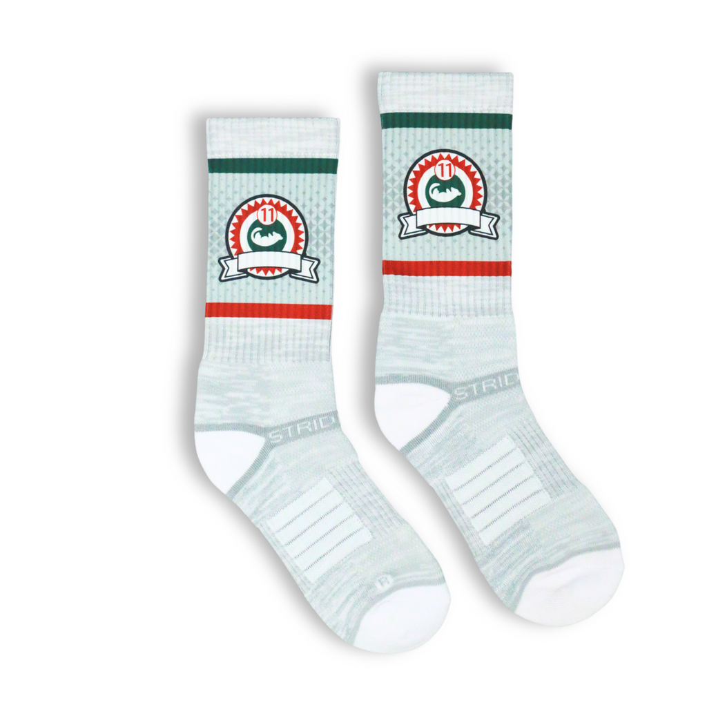 White crew socks featuring a possum lodge logo on the leg. 